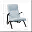 Fauteuil capitonné en tissu clair avec sièges confortables et design polyvalent pour les intérieurs modernes