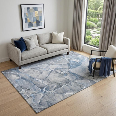 5' X 8' Blue And Ivory Abstract Washable Area Rug With UV Protection