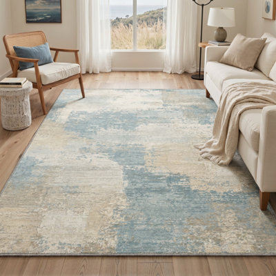 Tapis abstrait ivoire / bleu lavable à la machine avec envers antidérapant