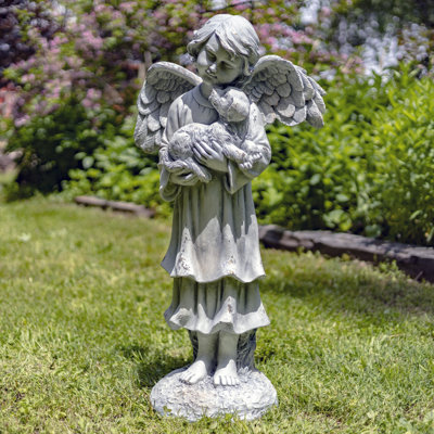 Statue d'enfant enfant ange tenant un chiot Magensium