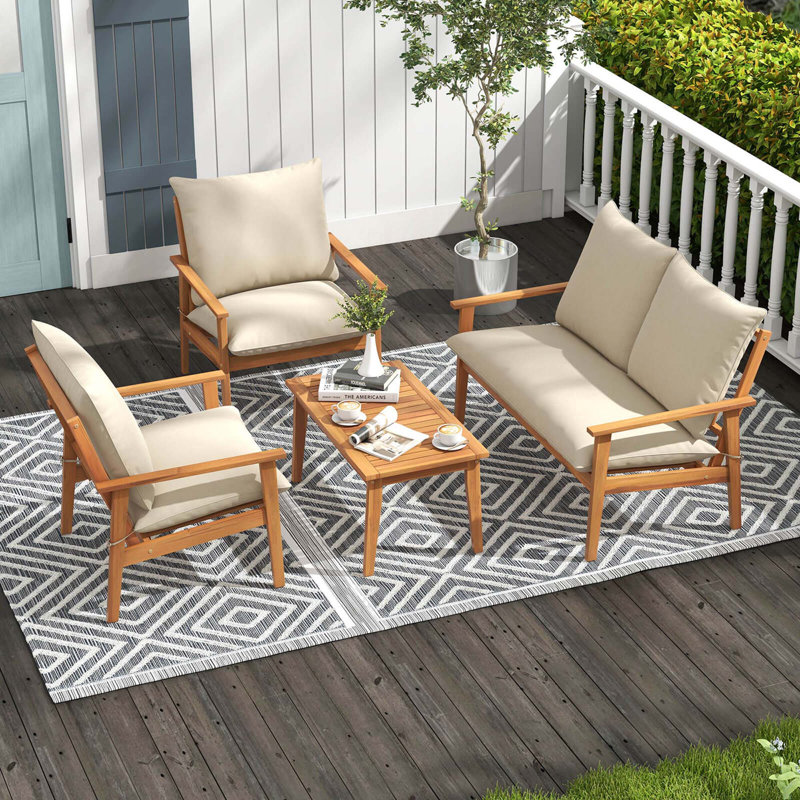 Ensemble de 4 meubles de patio en bois d'acacia avec coussins moelleux et table basse