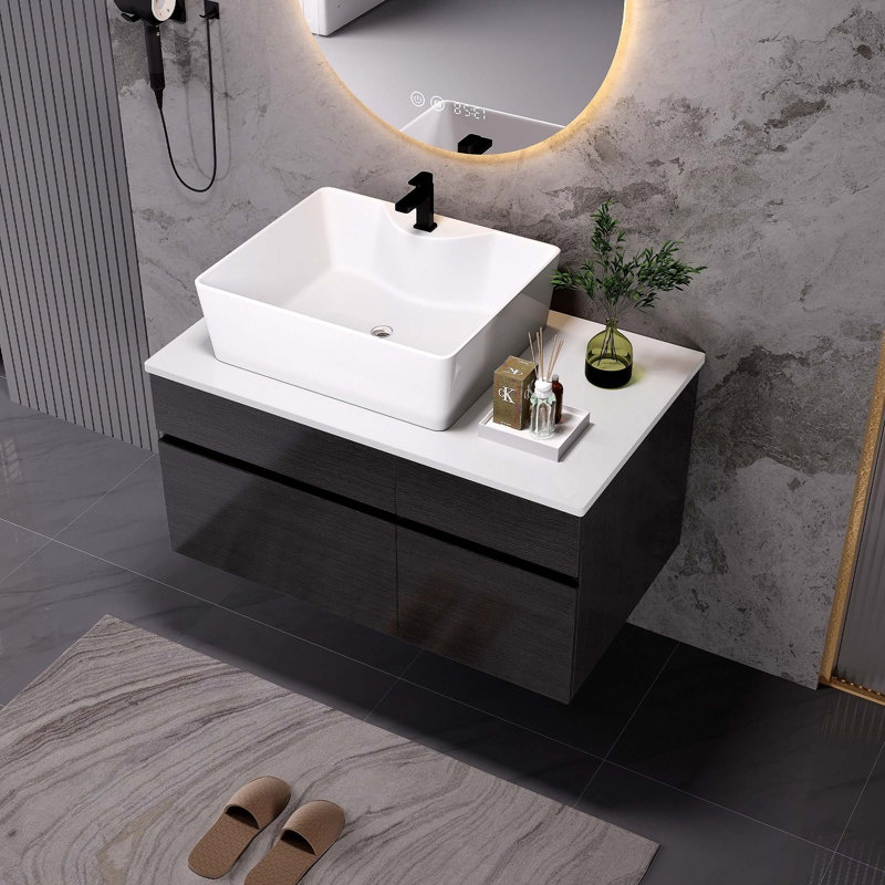 Petit meuble-lavabo flottant moderne avec lavabo en céramique intégré et rangement spacieux, parfait pour les espaces contemporains.
