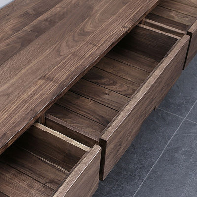 Cabinet audiovisuel noir avec tiroir en noyer