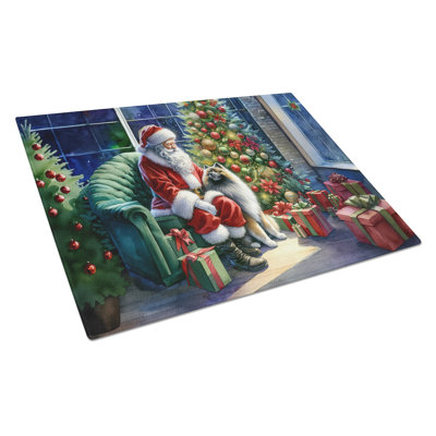 Keeshond and Santa Claus Glass Cutting Board