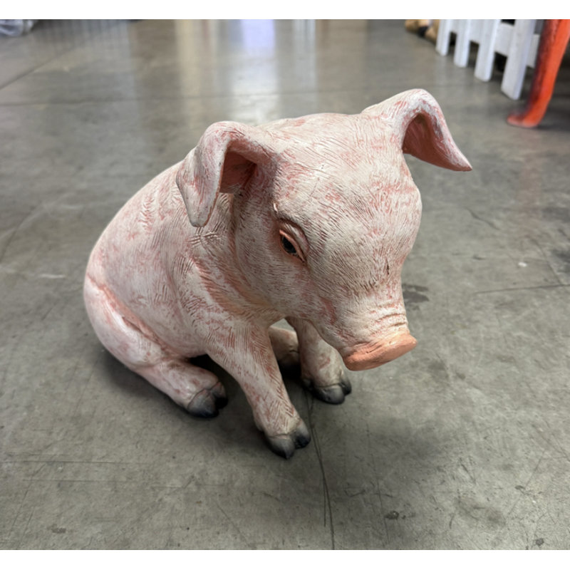 Statue de cochon assis