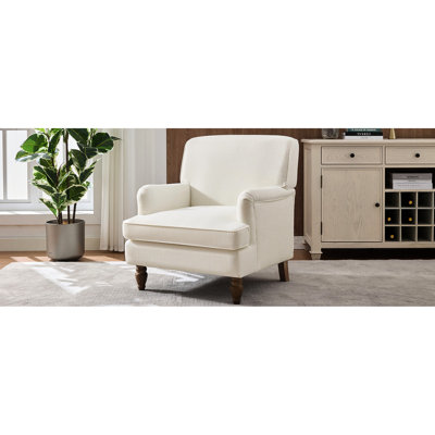 Fauteuil crème rétro avec revêtement en lin et pieds tournés en bois d'hévéa antique, pour lire un magazine dans un livre rembourré confortable