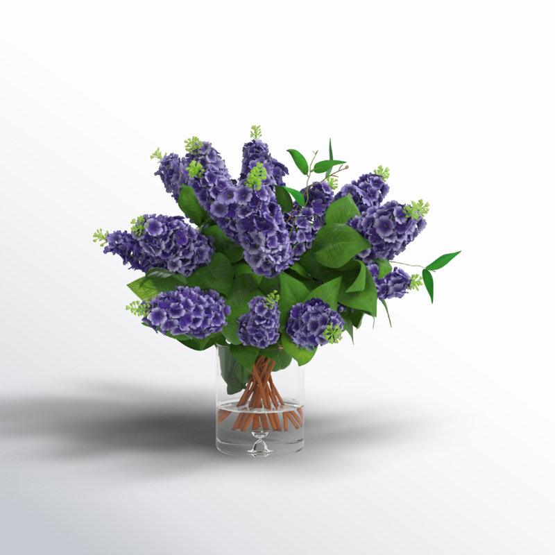 Italian Lilac Floral Arrangement In A Cylindrical Glass Vase