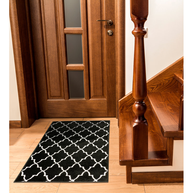 Tapis noir en polypropylène à motif floral Spiceland