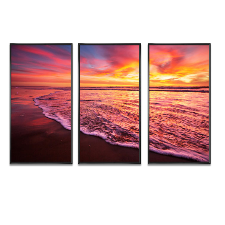 Beautiful sunset on the ocean with pink, red, and or