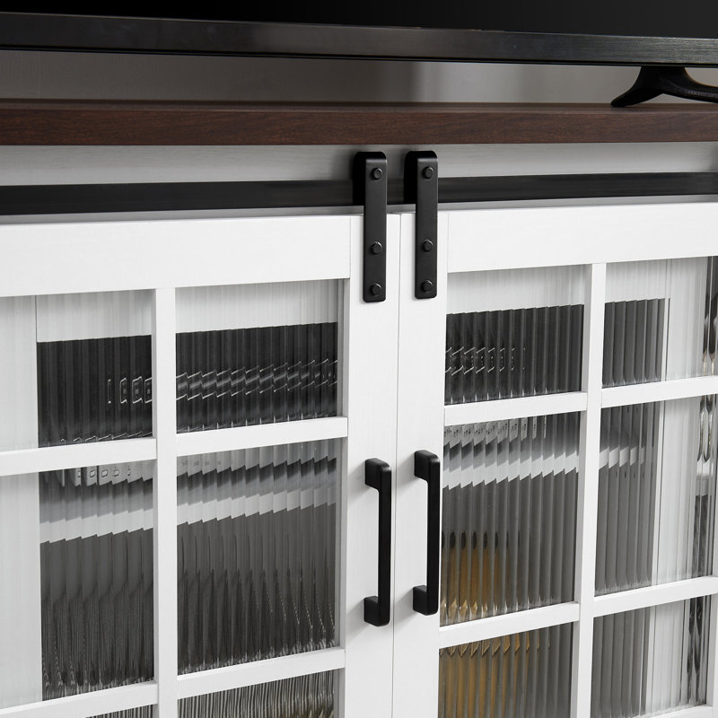 Console de télévision blanche et brune avec portes coulissantes et beaucoup de rangement pour la télé 65 po.