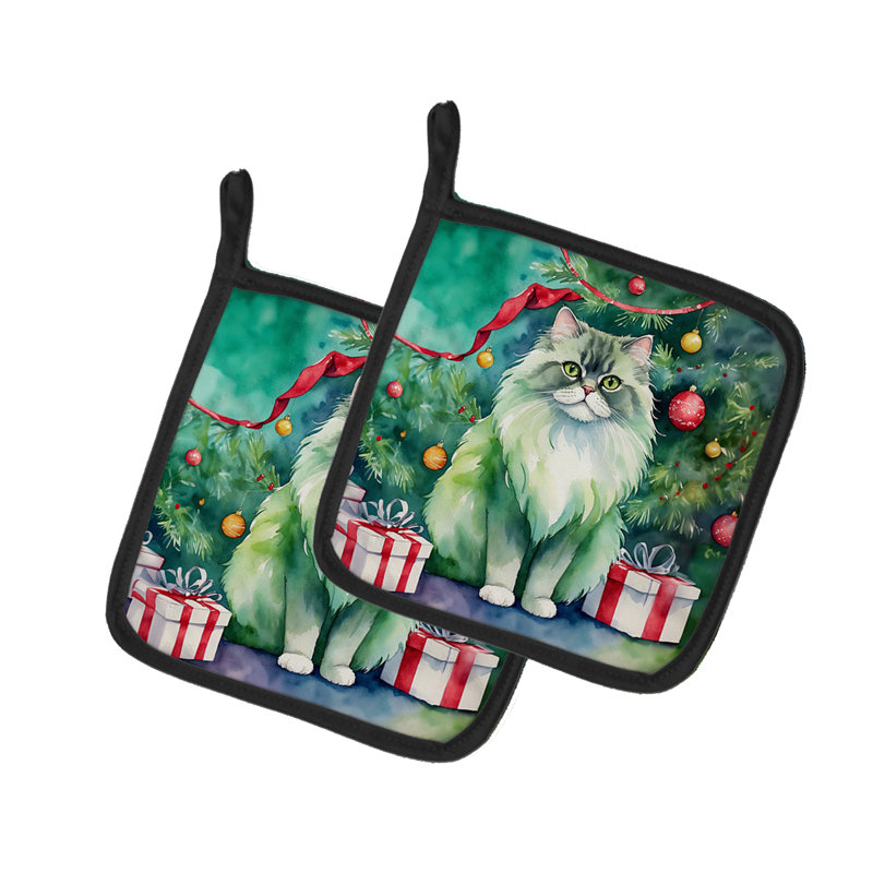 Chat persan près de l'arbre de Noël - paire de poignées