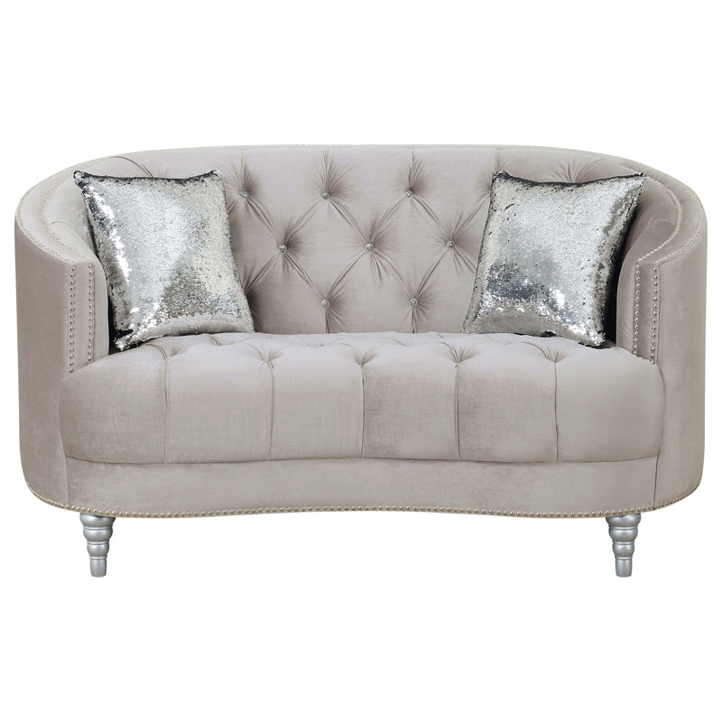 Causeuse grise grise contemporaine avec capitonnage