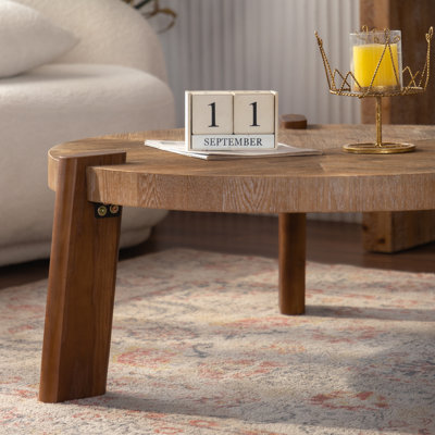 Table basse rustique ronde à chevrons avec plateau en bois massif et pieds fuselés
