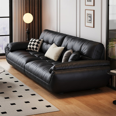 Causeuse-coussin modulable noire en cuir véritable