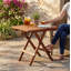 Petite table pliante en teck, finition huilée