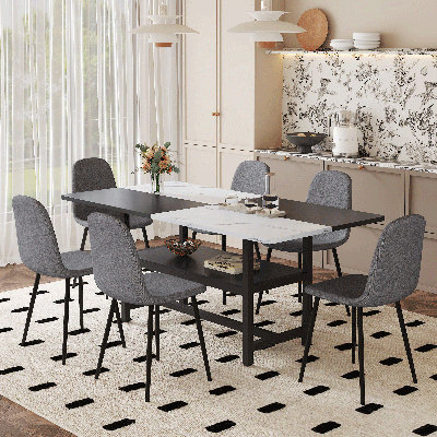 Table de salle à manger avec rangement au milieu des pieds de la table, jumelée à 8 chaises avec coussins arrondis