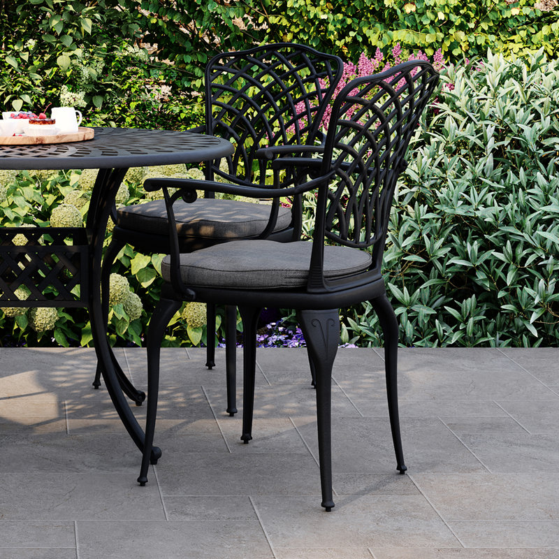 Thiazi 4 - Person Patio Dining Set with Round Table , Cushions Included
