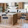 Deherrera Modern Swivel Counter or Bar Stool with Open Low Back and Footrest in Metal and Faux Leather