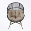 Fauteuil ovale en osier avec coussin