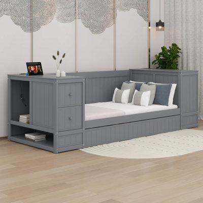 Lit de jour simple avec couchette, accoudoirs de rangement et station de charge
