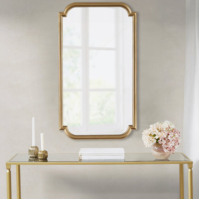 Miroir mural doré