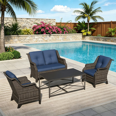Ensemble de patio extérieur en osier pour 4 personnes avec causeuse, 2 chaises, une table basse et un coussin bleu