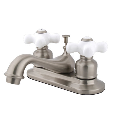 Kingston Brass Restoration Two-Handle 3-Hole Deck Mount 4" Centerset Bathroom Faucet with Plastic Pop-Up