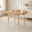 Table rétractable en MDF imitation bois avec pattes en métal argenté, gain de place et élégante pour une salle à manger moderne