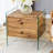 Double-drawer bedside table. The board surface is MDF with wood grain sticker, and both sides are transparent tempered glass. The design is simple and elegant, with excellent storage functions.