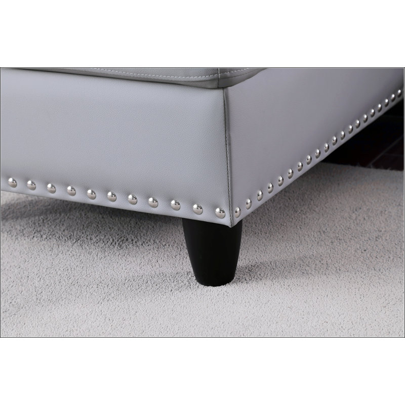 Canapé modulaire en similicuir avec repose-pieds