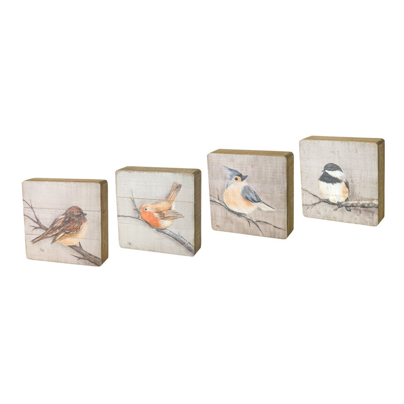 Ensemble de quatre décorations murales en bois massif brun