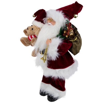 Figurine de père Noël avec sac-cadeau