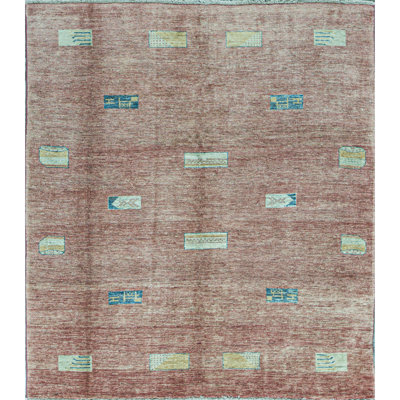 Tapis rose de haute qualité noué à la main