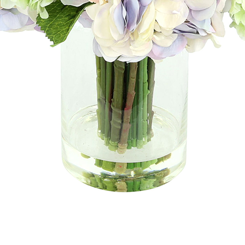 Arrangement d'hortensias, lilas et delphinium