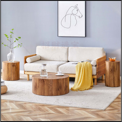 Ensemble de trois tables basses cylindriques en bois aggloméré à motif de marbre