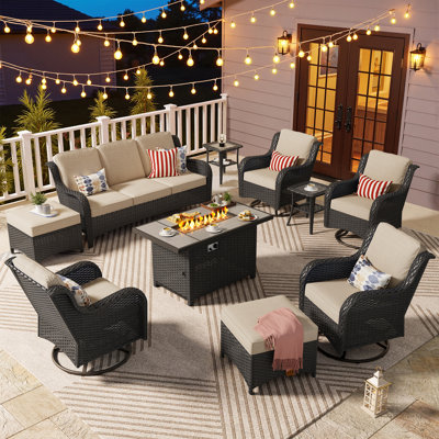 Outdoor Wicker 7 Person Seating Group With Cushions With A Fire Pit