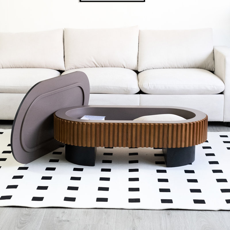 Table basse elliptique de 111 cm (43,7 po) au design unique en forme de champignon, avec rangement dissimulé pour accessoires de bureau. Table contemporaine, couleur noir et brun, solution multifonctionnelle.