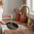 Brushed gold single-handle high-arc kitchen sink faucet with a retractable pull-down spray head; dual-function kitchen sink faucet.-118661921