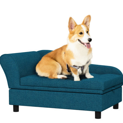 Canapé surélevé pour chien de taille moyenne, bleu foncé, avec rangement dissimulé, offrant confort et style. Coussin moelleux et espace de rangement. Convient aux petits chiens.
