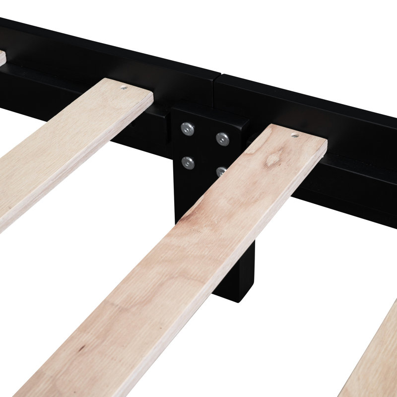 Structure de lit plateforme rétro en bois noir avec lattes pour une qualité durable