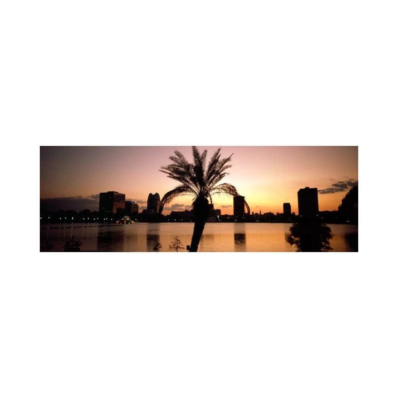 Silhouette Of Buildings At The Waterfront, Lake Eola, Summerlin Park, Orlando, Orange County, Florida, USA by Panoramic Images - Wrapped Canvas Panoramic Print