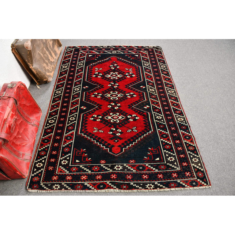 Tapis turc fait à la main avec des motifs géométriques rouges, idéal pour la décoration de salon et le style oriental traditionnel
