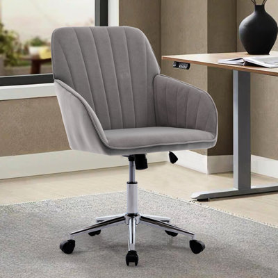 Chaise de bureau confortable pour la maison, revêtement en velours gris et base robuste pour une journée de travail agréable. Chaise réglable en velours, support ergonomique en métal pour une productivité optimale.