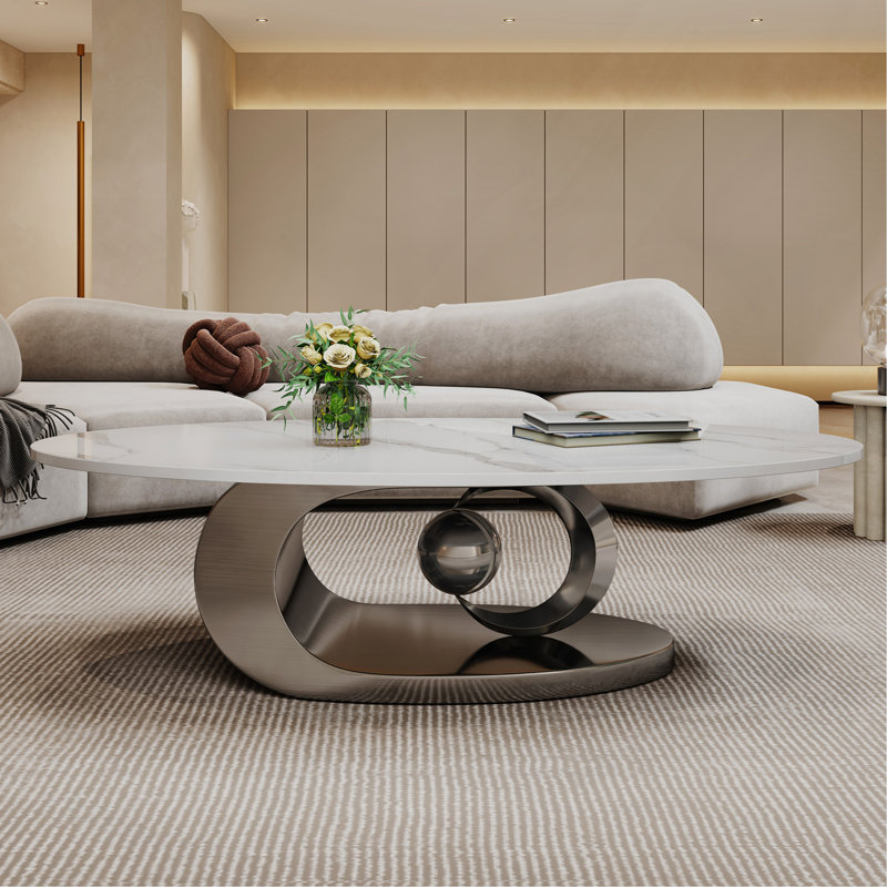 Table basse en marbre avec base sculpturale en acier inoxydable