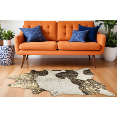 5' X 7' Ivory Brown and Gold Cowhide Hand Knotted Area Rug