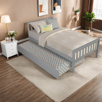 Lit simple gigogne peu encombrant en bois massif de conception moderne pour les petits espaces de vie