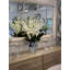 Delphinium And Magnolia Leaves In Ceramic Vase