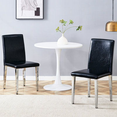 Chaises de salle à manger noires en polyuréthane avec pieds en métal argenté (de 2), minimalistes et confortables, rembourrage en éponge à haute élasticité, support de glissement stable à deux pieds, apparence tendance pour la décoration intérieure,