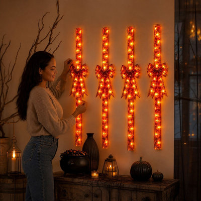 Décoration d'Halloween : nœud lumineux suspendu en tissu imprimé, décoration pour porte ou meuble.