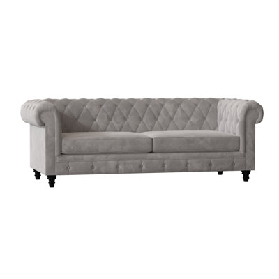 Canapé Chesterfield à accoudoirs roulés